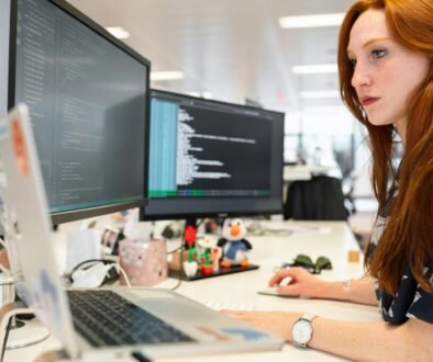 women working on laptop in office