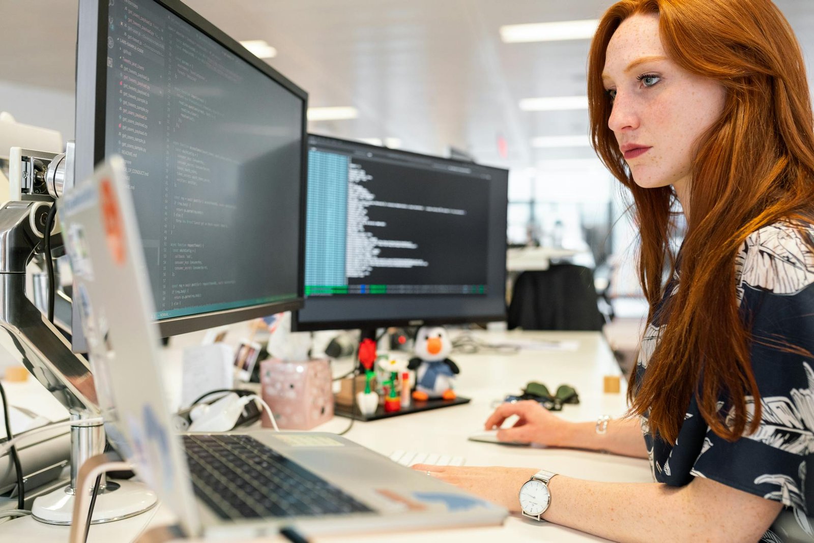 women working on laptop in office
