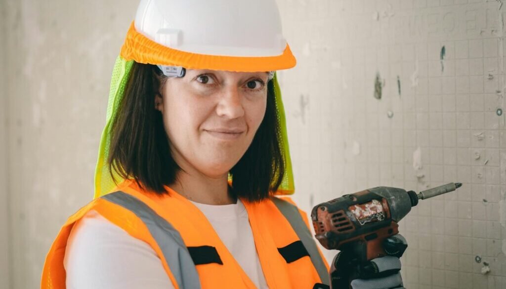 a women mechanic with drill machine
