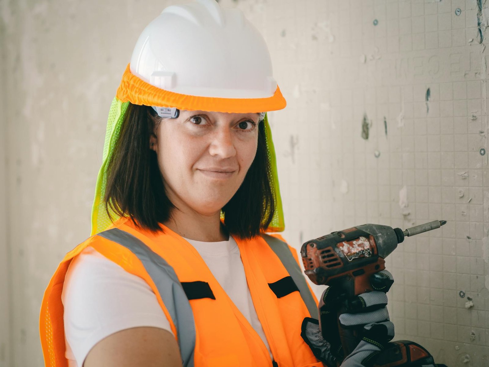 a women mechanic with drill machine